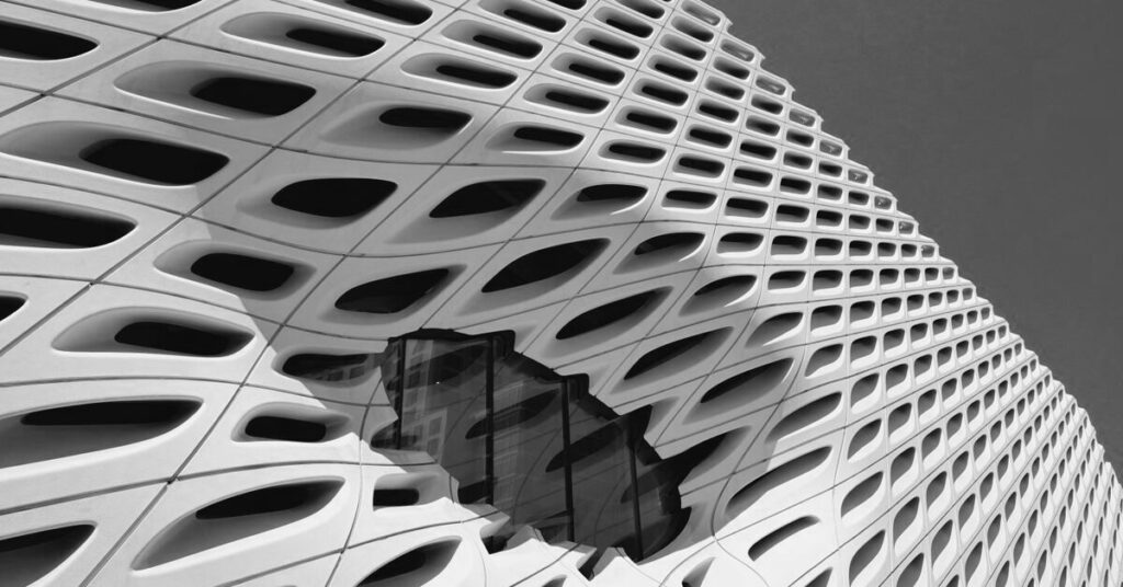 Honeycomb geometric building facade in greyscale